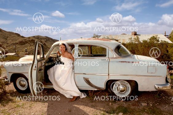 Beautiful Bride in a Rusted Out Car