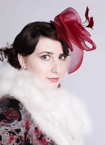 Glam brunette woman in red hat retro style fashion...