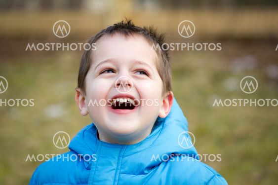 Portrait of a cute little boy playing outdoors