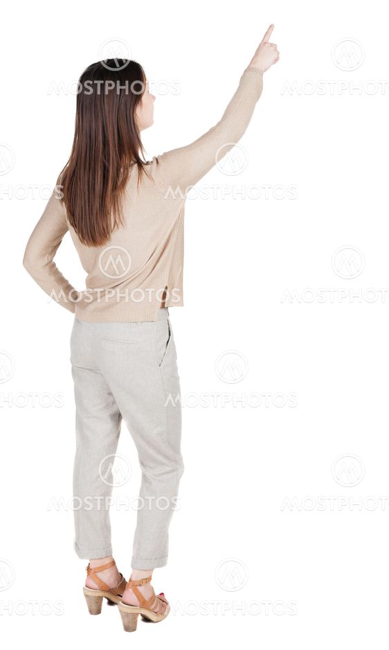 Back view of pointing woman.