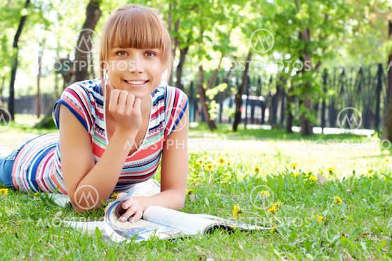 portrait of a beautiful woman in summer park