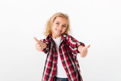 Portrait of a happy little girl standing