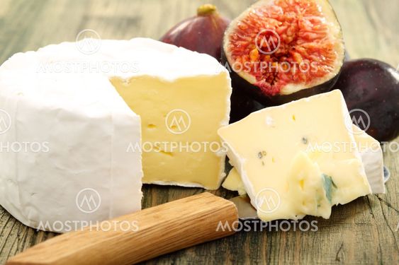 Cheese and fresh figs closeup.