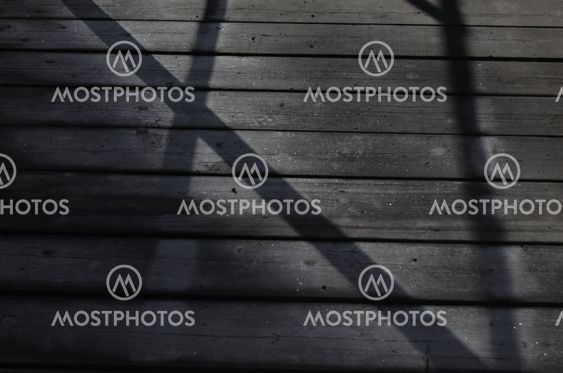 Surface icy boards with shadows from the rail Image
