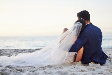 Wedding, hug and back of couple on beach for...