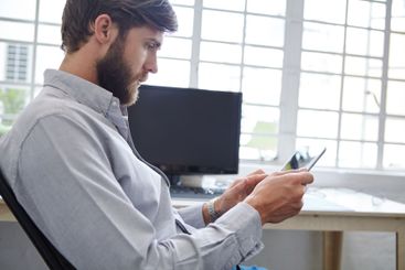 Man, typing and professional with tablet in office,...