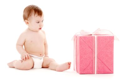 baby boy in diaper with big gift box