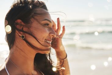 Beach, ocean and face of woman in summer for vacation,...