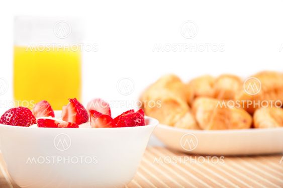 Breakfast with berries,orange juice and croissant