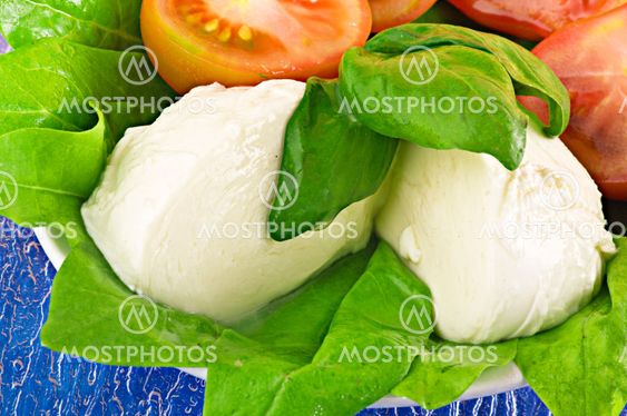 mozzarella tomato and basil on white