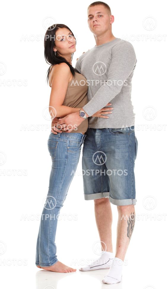Portrait of a beautiful young happy smiling couple isolated