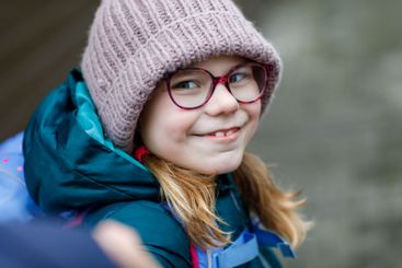 Cute little girl o the way to school. Healthy happy...