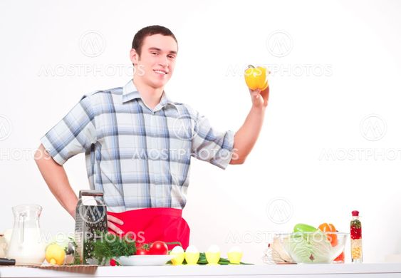 portrait of a young man with bell pepper