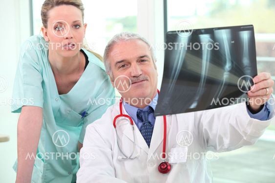 Medical team looking at x-rays