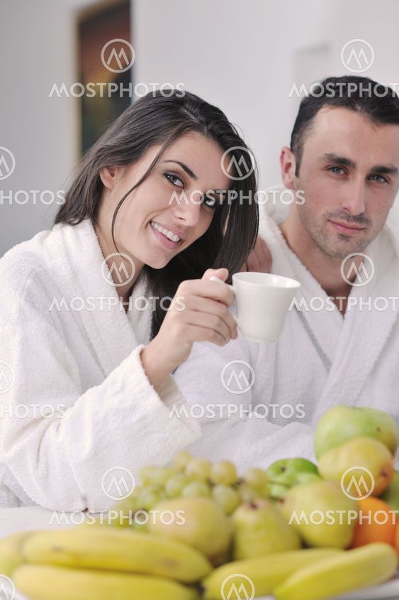 young couple have fun in modern kitchen