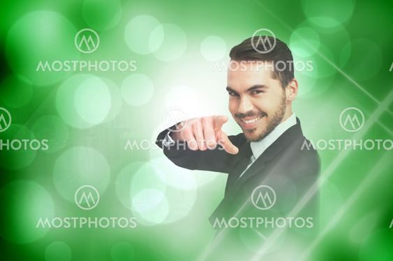 Composite image of happy businessman pointing his finger