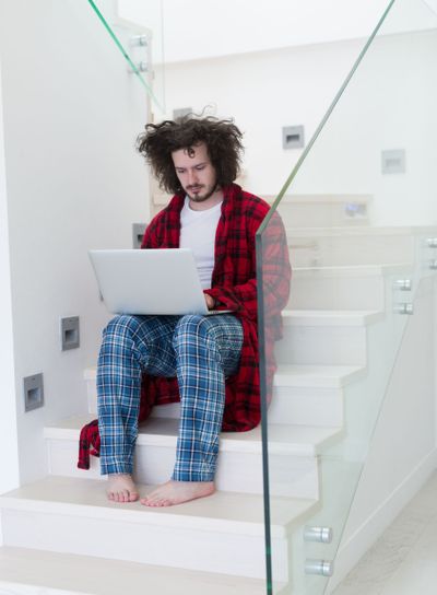 freelancer in bathrobe working from home