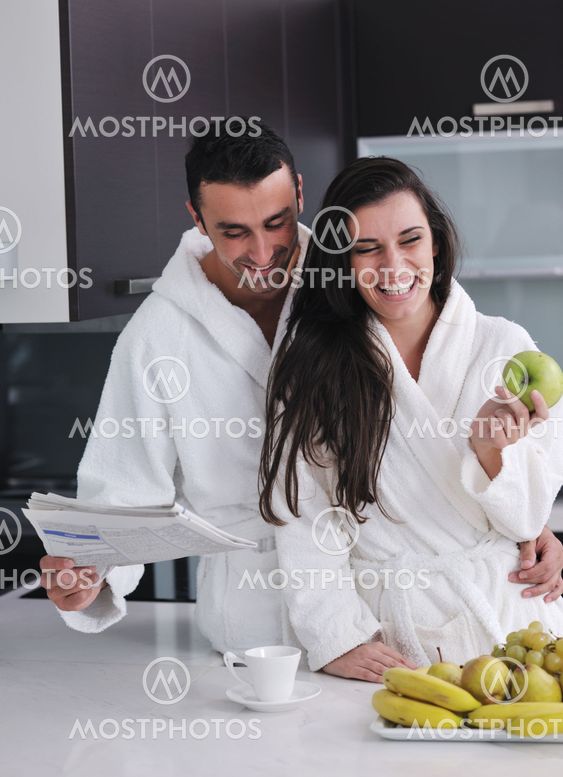 young couple have fun in modern kitchen
