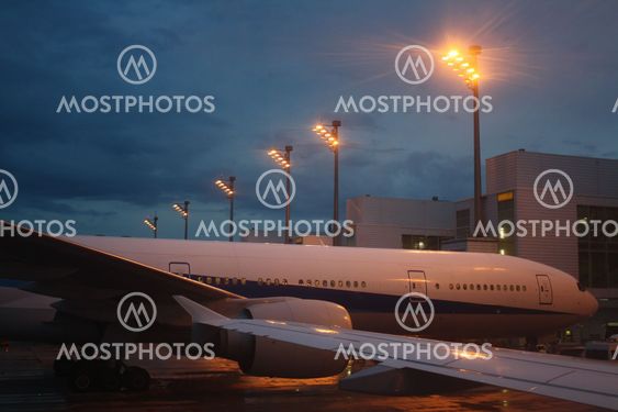 Airplane on airfield at night