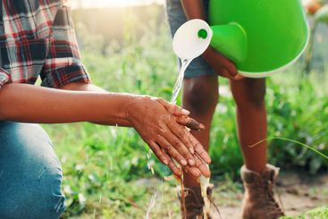 Environment, washing hands and watering can with people...