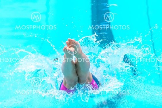 Female swimmer diving into the water at the National...