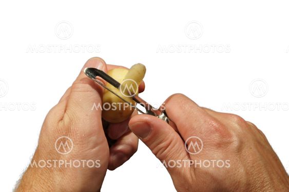 Peeling an potatoe, white background