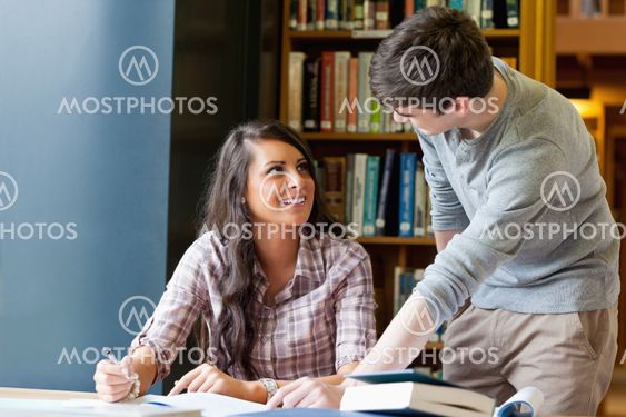 Young students helping each other