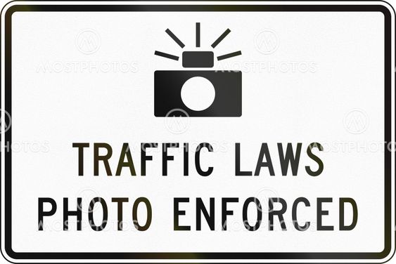 United States MUTCD road sign - Traffic laws photo enforced