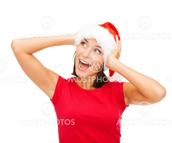 surprised woman in santa helper hat