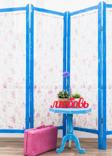 Blue wooden decorating screen with textile panels