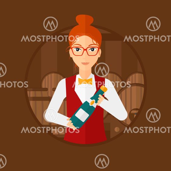 Waitress holding bottle in wine cellar.