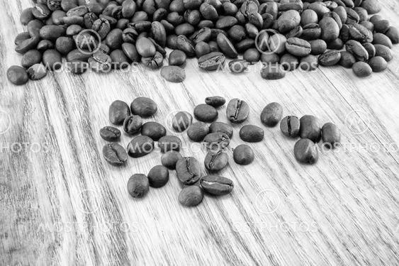 Coffee beans on vintage wooden board