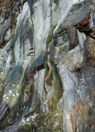 Large rocky rocks. Rocks of rocks. Gray moss-covered rocks
