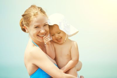 happy family on the beach. mother and baby daughter  