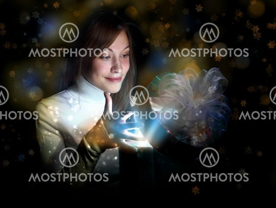 Young woman reading a magic book