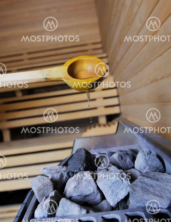 hot stones and splashing water in sauna