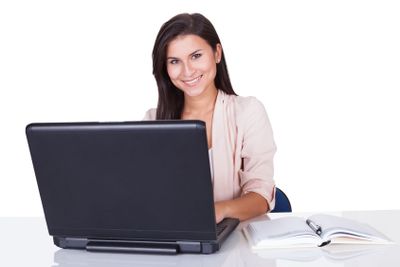 Woman sitting working at her laptop