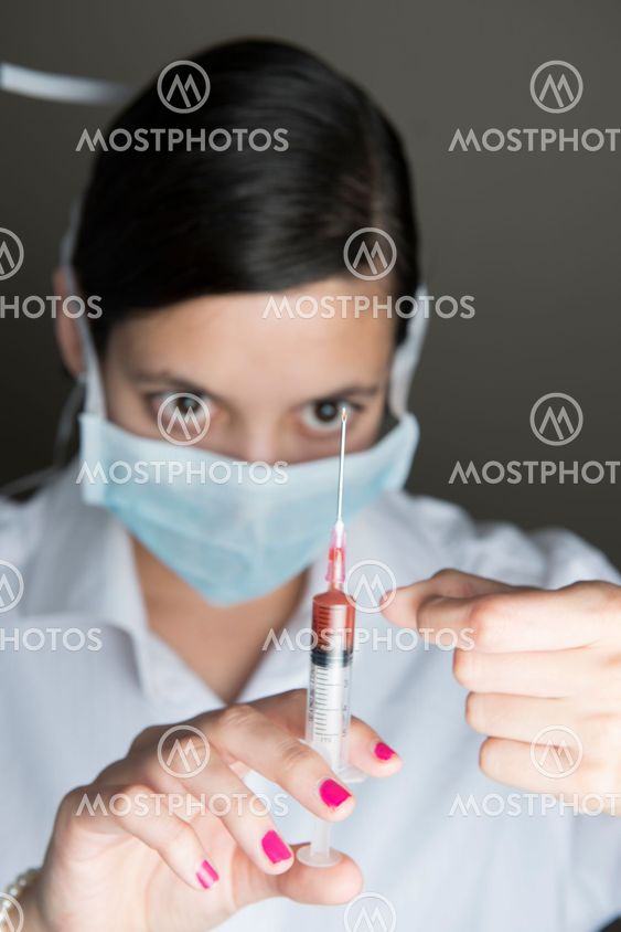 Beautiful women holding syringe