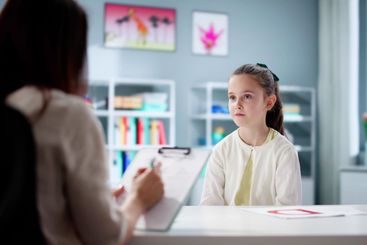 Professional Social Worker Treating Child with ADHD