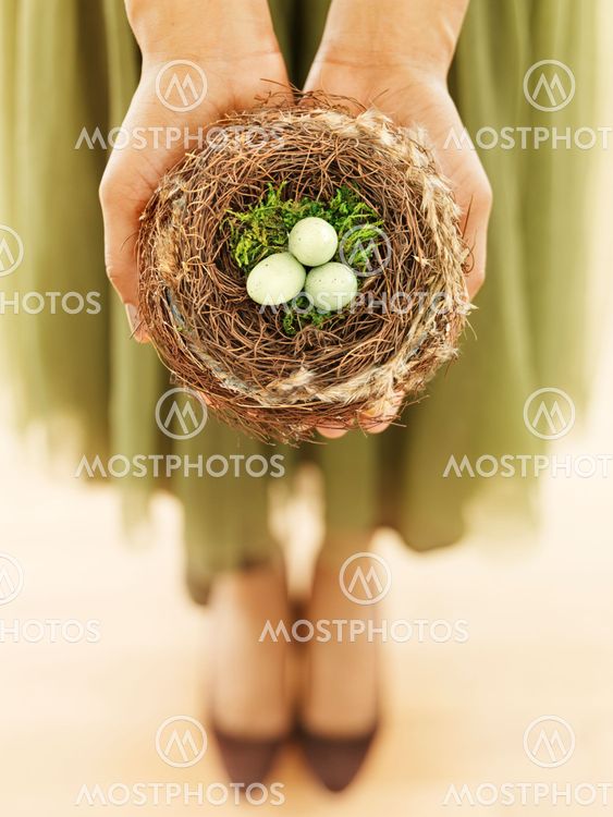 Woman holding bird nest