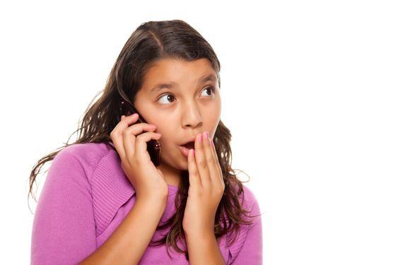 Shocked Pretty Hispanic Girl On Cell Phone