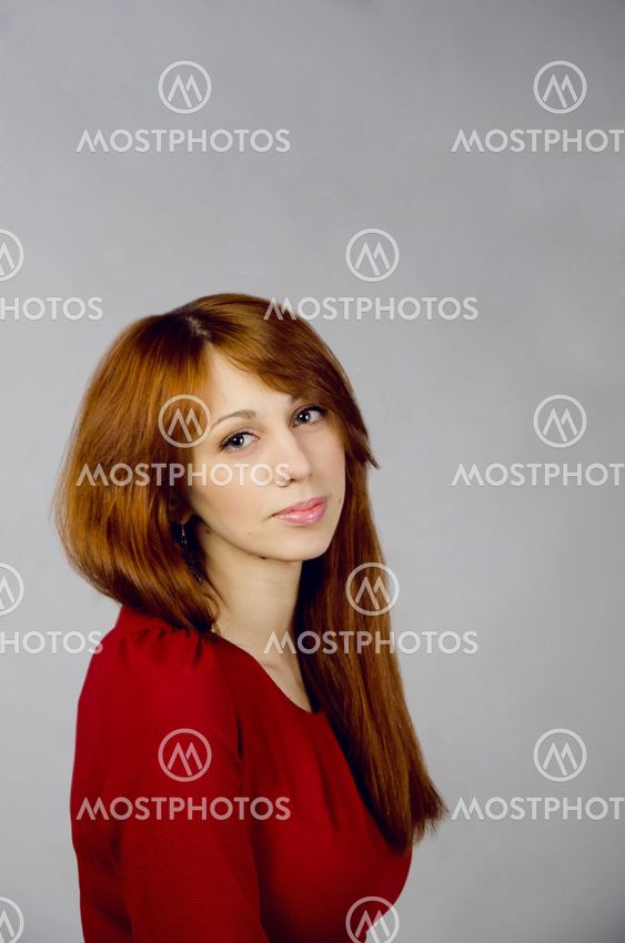 Beautiful young girl in a red dress