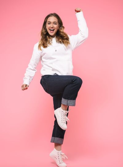Full length image of Joyful woman wearing in casual clothes