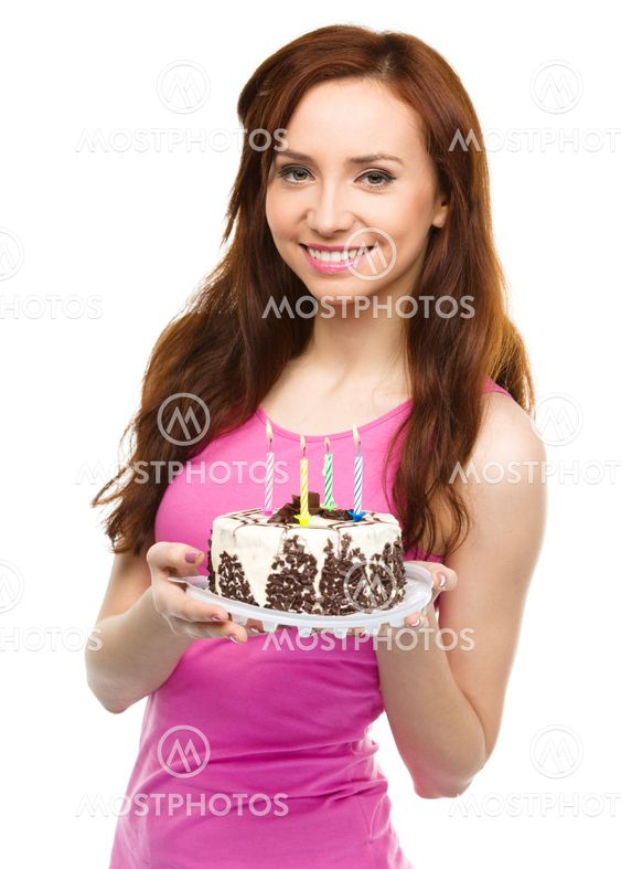 Young woman with anniversary cake