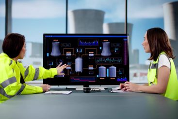 Female Engineer Operates Control Panel