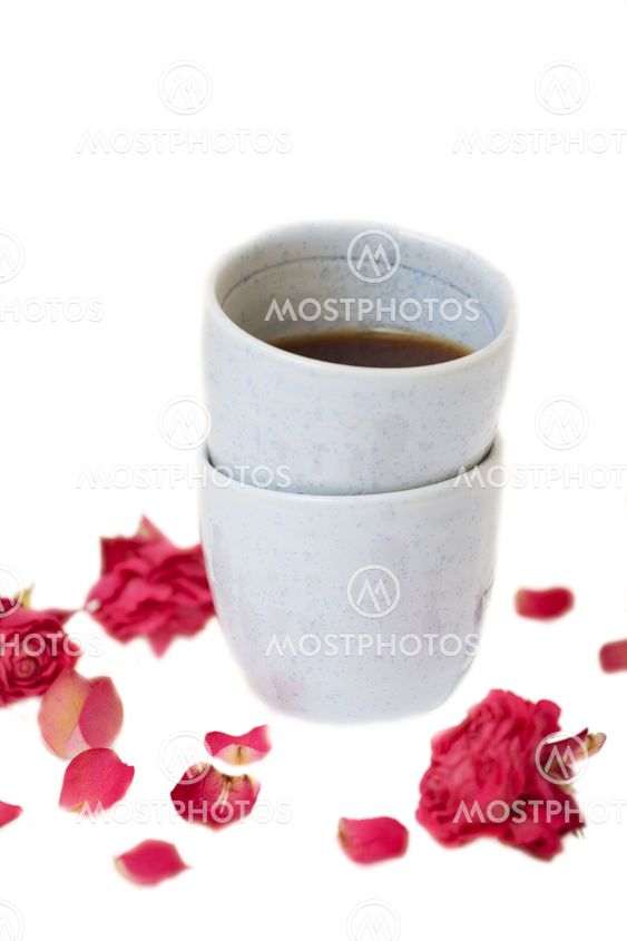 Chinese tea cups with tea and dried petals