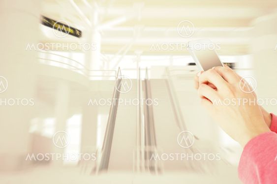 Composite image of woman texting with her mobile phone