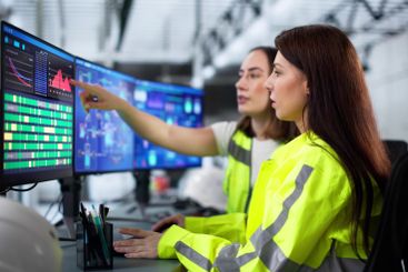 Female engineer closely monitors green energy project