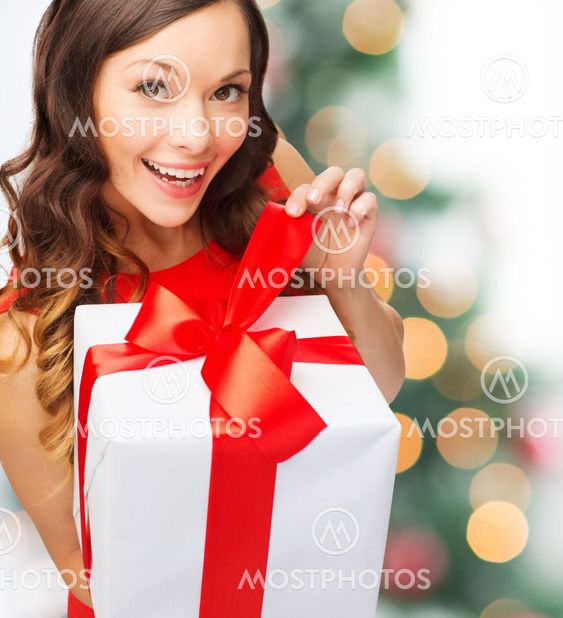 smiling woman in red dress with gift box