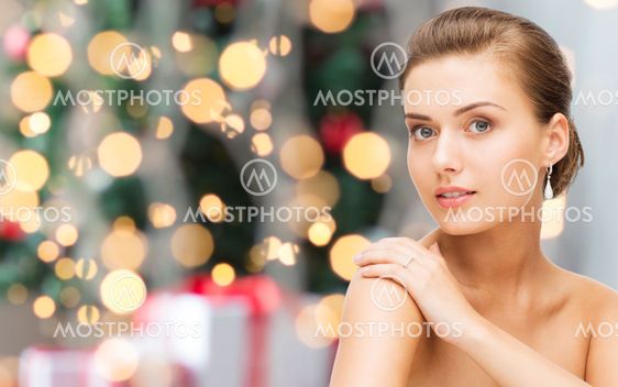 beautiful woman with diamond earrings and bracelet